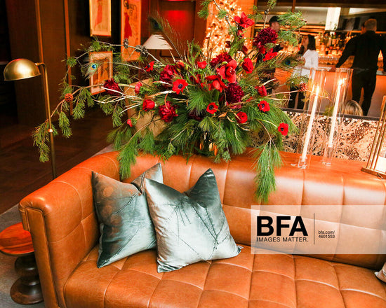 holiday flower arrangements with pine/peacock feathers